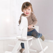 Rocking horse in solid wood white lacquered, growing with removable protective ring