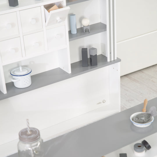 Candyshop bianco, con accenti grigi, cassetti, laterale e frontale