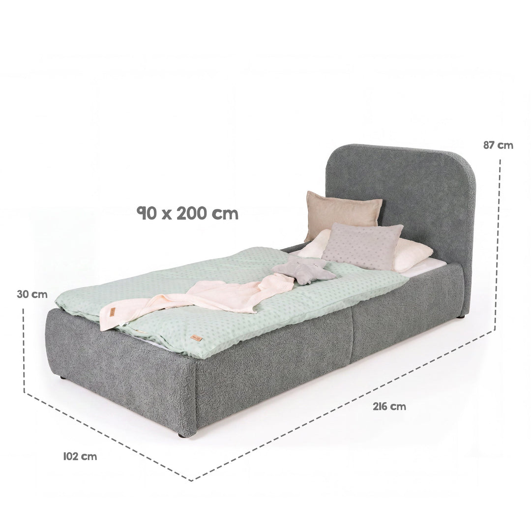 Schéma des dimensions du lit enfant gris : surface de couchage 90×200 cm, dimensions totales 216×102×87 cm, coffre 30 cm.