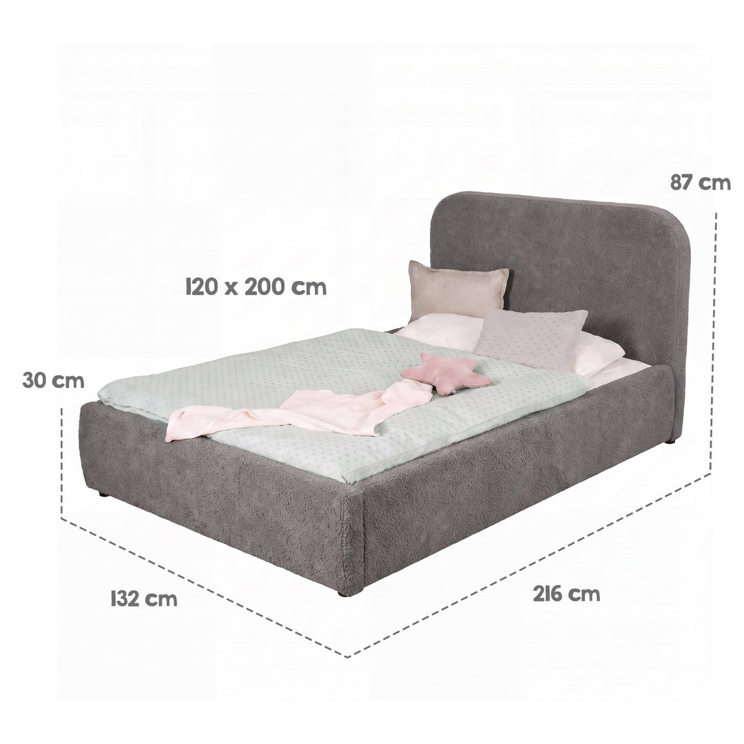 Schéma des dimensions du lit gris avec linge de lit : surface de couchage 120×200 cm, dimensions totales 216×132×87 cm.