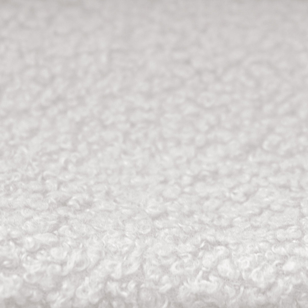 Gros plan du revêtement en tissu bouclé blanc du lit enfant roba Little Dream.