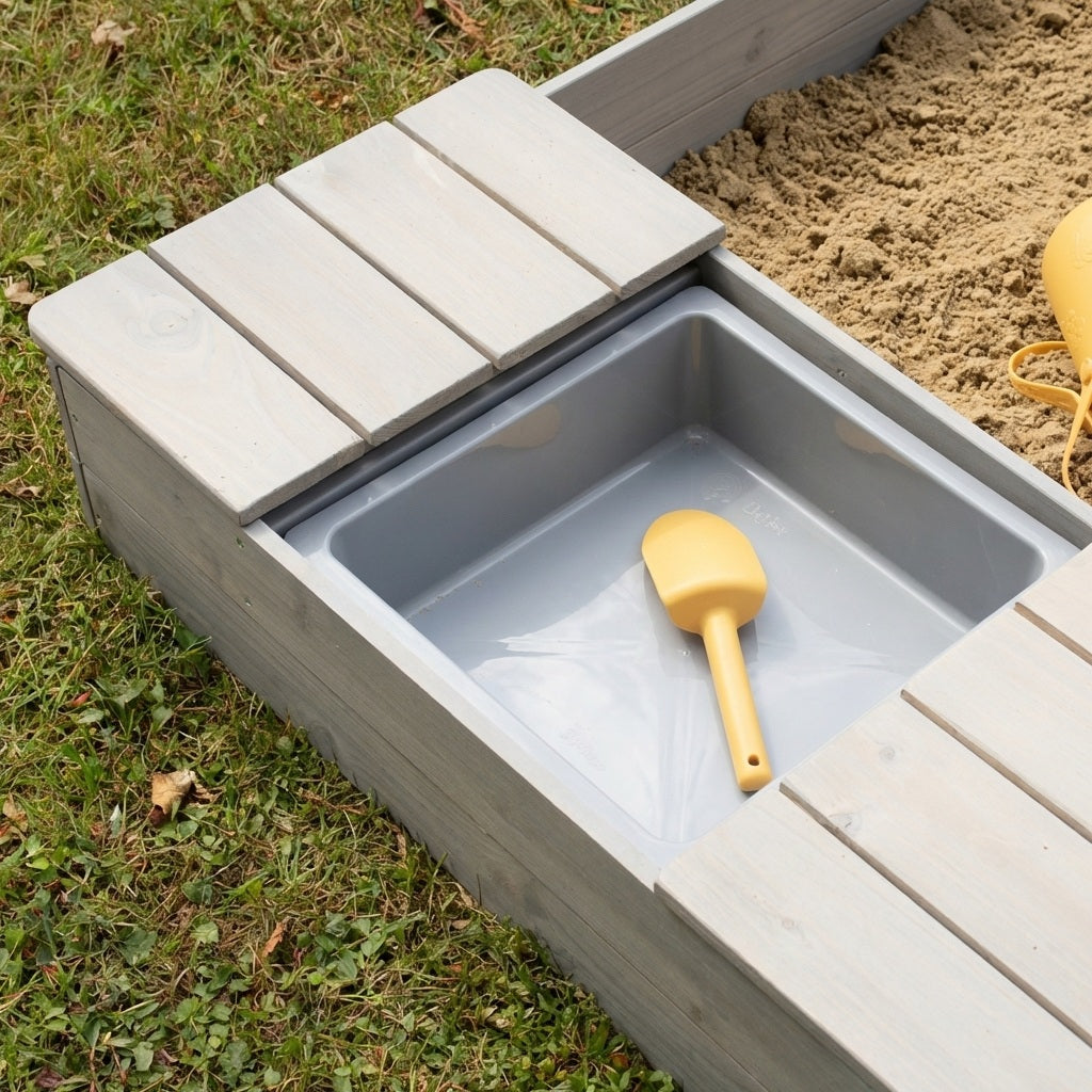 Caja de arena 'Outdoor +' gris lasurada, incluye banco abatible y 2 cubos de juego