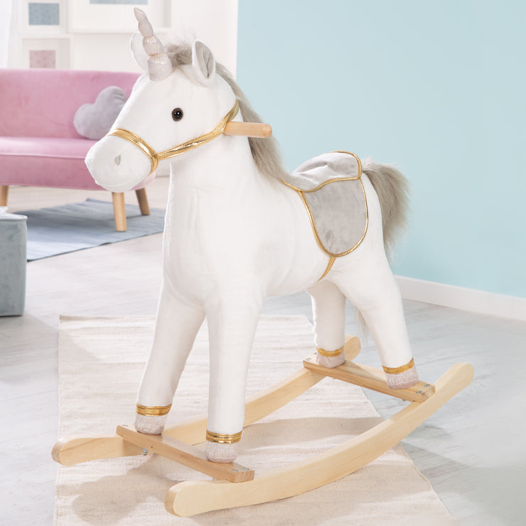 Unicornio mecedor, tapizado, sillín y brida en gris/oro, 63 x 31 x 73 cm, sonido, a partir de 24 meses