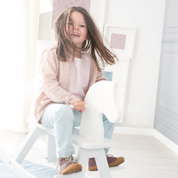 Rocking horse in solid wood white lacquered, growing with removable protective ring